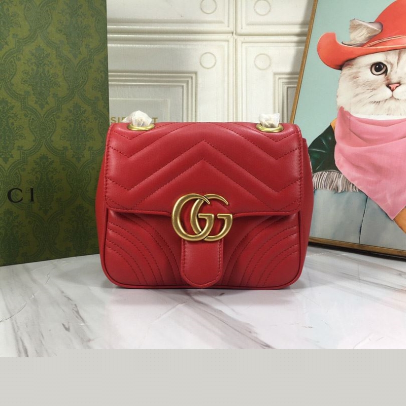 G*u*i clutch bags